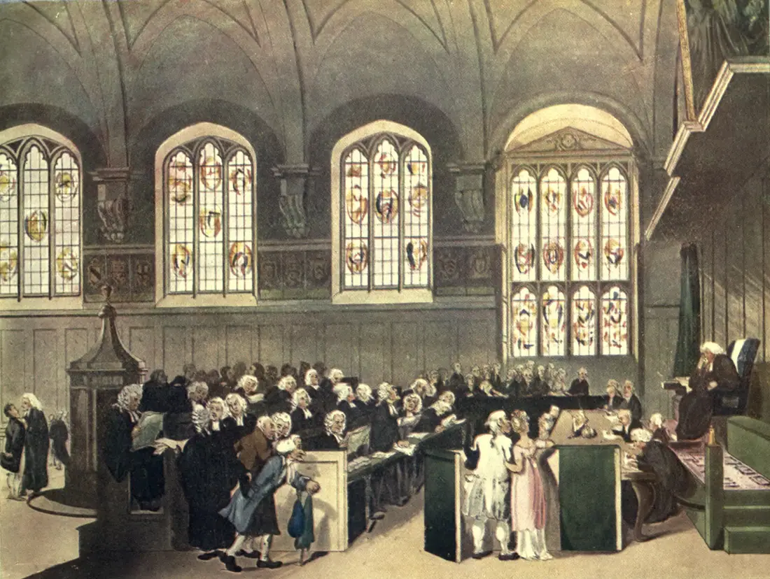Hand-coloured aquatint of a crowded panelled hall with a robed judge under a canopy, rows of wigged barristers at tables, and spectators along the walls.