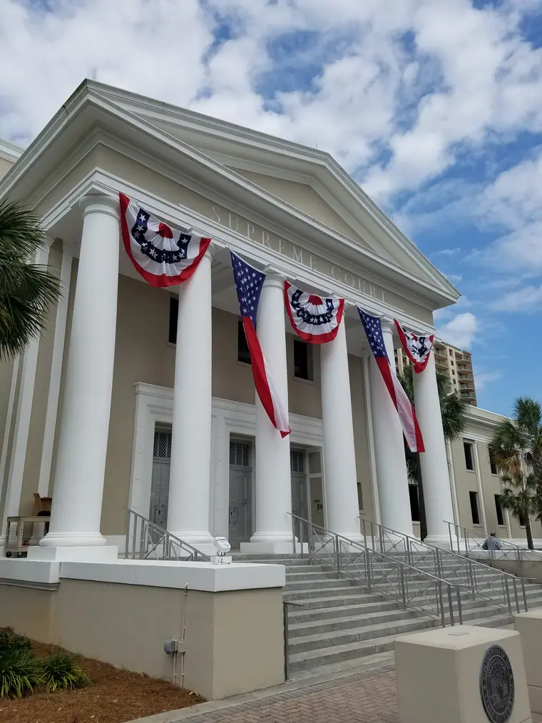 Side view of the Florida Supreme Court Building in Tallahassee, hung with patriotic bunting.